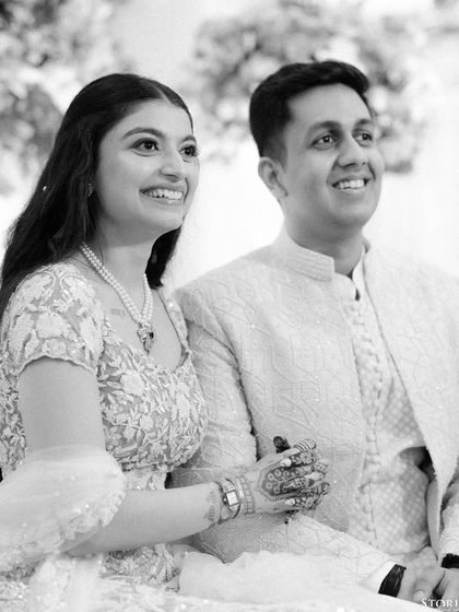 A beautiful black and white candid of the couple during their Roka ceremony, their faces glowing with happiness.