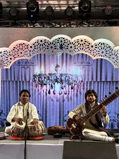 A classic sitar and tabla jugalbandi at the iconic Taj Mahal Palace, Mumbai. This setup is ideal for creating an atmosphere of elegance and sophistication, perfect for exclusive gatherings and wedding events.