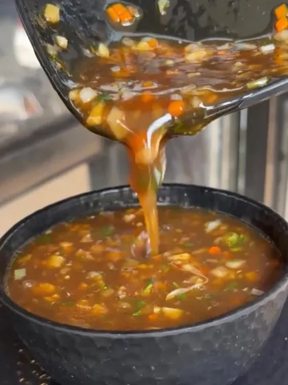 It's raining soup! A video showing my flavourful Manchow soup being poured into a bowl, perfect for a rainy day.