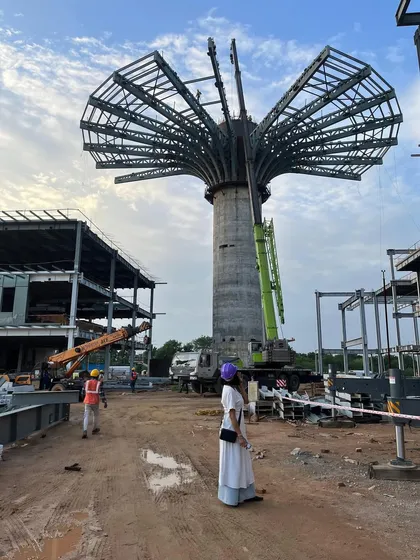 Our ambitious designs are grounded in the reality of construction. This image shows the "Beacon" for the ePositive research campus taking shape, a 40 meter tall centerpiece that is a testament to our commitment to turning bold architectural visions into tangible structures.