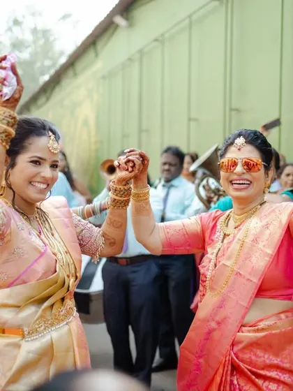 The bride dancing with her friends and family, all sharing in the joy of her wedding day.