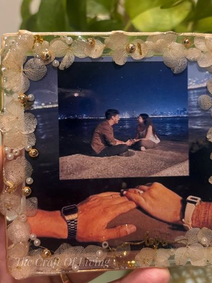 Another angle of the custom resin photo frame, held against a natural background. It's a perfect way to preserve a cherished memory.