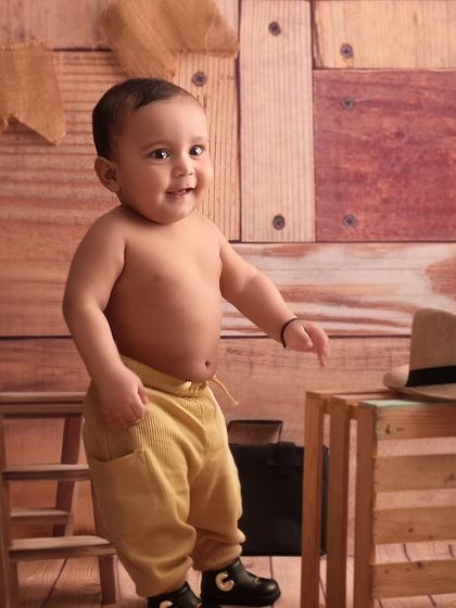 Little cowboy Raj is exploring the studio, looking absolutely adorable in his yellow pants and boots.