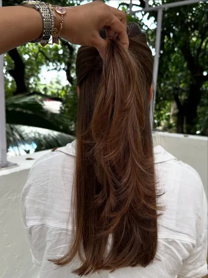 I love that this client comes all the way from New York for her hair sessions. This is a classic color refresh, where I blend her roots and brighten her highlights for a seamless look.