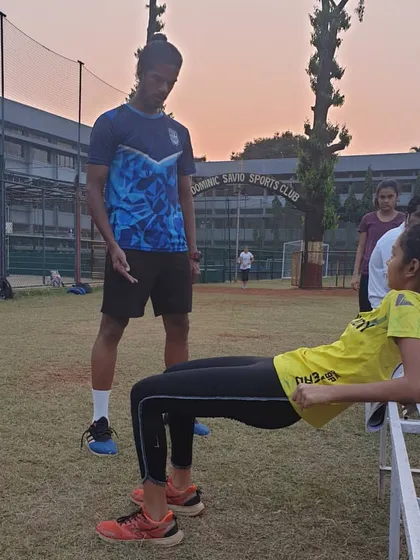 A closer look at the hip thrust technique, with a coach providing guidance to ensure proper muscle activation and form.