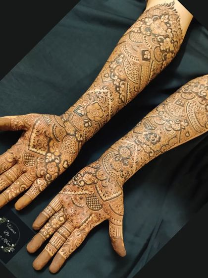 A complete bridal design covering both arms up to the elbows, featuring a mix of traditional Indian patterns for a classic and timeless look.