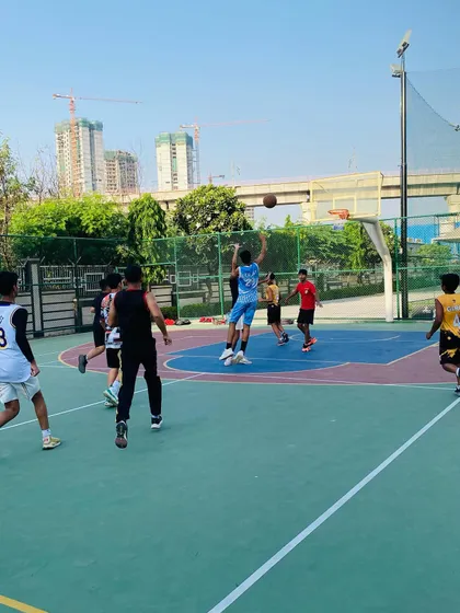 A player takes a jump shot during a fast break.