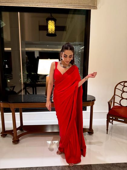 A full-length view of my custom red saree. The simplicity of the design is elevated by a statement necklace, proving that sometimes less is more.
