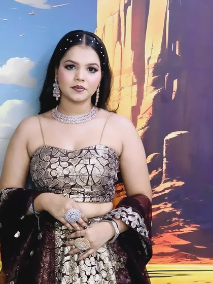 Another look at the printed gold and maroon lehenga, showing how it can be styled for a modern, youthful vibe.