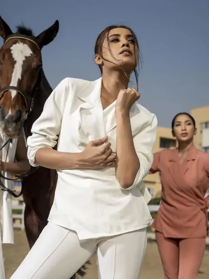 I excel at directing and executing complex, high-concept campaign shoots. This image, featuring multiple models and a horse, showcases my ability to manage large-scale productions and create a powerful, cohesive brand narrative.