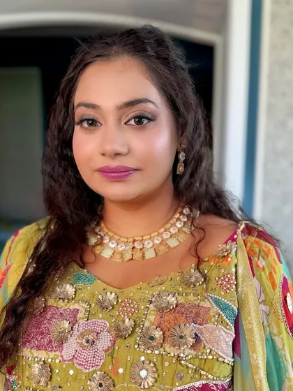 A close-up of the carnival makeup. I used a pop of pink on the lips and a soft, shimmery eye to match her multi-colored outfit.