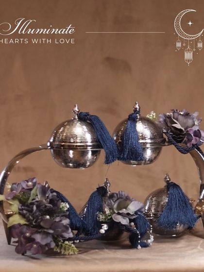 Illuminate hearts with love this Eid. This beautiful silver platter with four lidded bowls is perfect for sharing treats with family and friends.