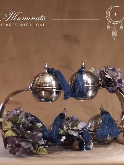 "Illuminate hearts with love." Our crescent-shaped server with lidded bowls, adorned with deep blue tassels, is a sophisticated and heartfelt gift for Eid.