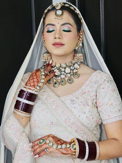 Another angle showing the heavy kundan necklace and the flawless makeup base.