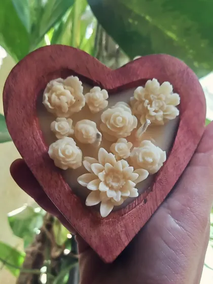 Our wooden heart candle, filled with delicate hand-poured wax flowers, was chosen as part of a serene condolence ceremony. It’s an honor to provide a small beacon of light during such moments.