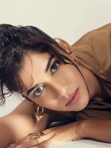A final close-up of this fierce and radiant look. The updo hairstyle and clean makeup are perfect for this kind of editorial work.