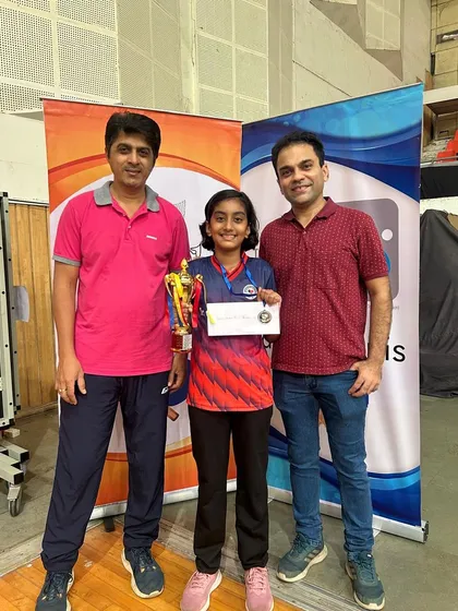 Mahika Susvirkar with her coaches and her first silver medal trophy from the U-11 Girls category at the Maharashtra State Championship in Pune.