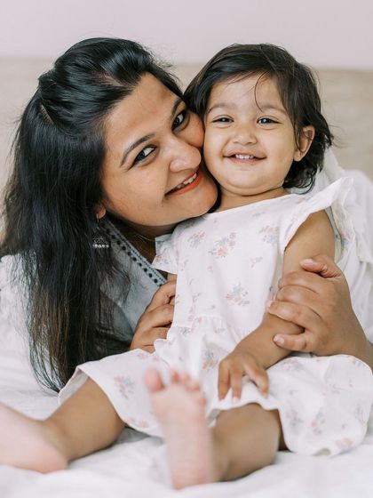 This room had no natural light, but that's no problem. I bring my portable studio lighting to create beautiful, bright, and airy portraits like this one, no matter the conditions.