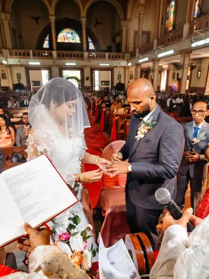 The exchanging of the rings, a pivotal moment in any wedding. I took a risk to get this unique over-the-shoulder perspective from behind the Bishop.