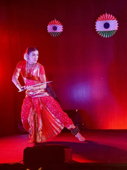 Performing in a dance drama for Independence Day celebrations in Reunion Island, France. Here I am portraying a warrior character, using a prop sword and a powerful stance to convey courage.