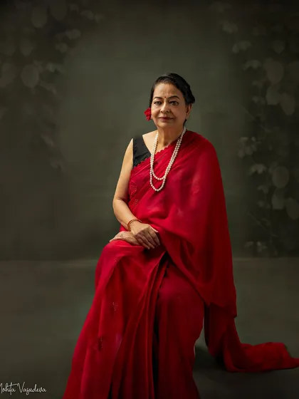 I feel so blessed to have this amazing woman as my mother-in-law. Her kindness and support are a gift, and capturing her grace and elegance in this beautiful red saree was an honor.