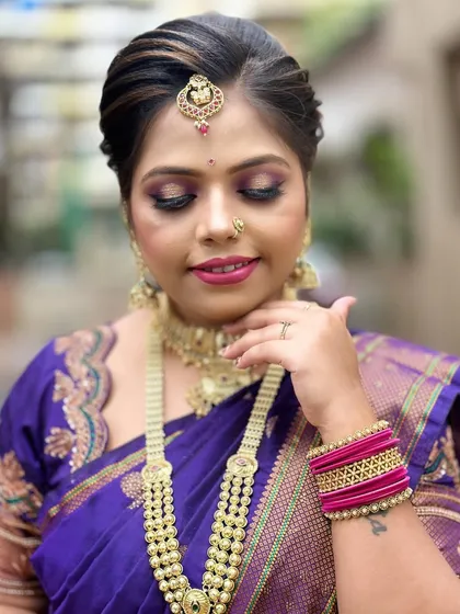A close-up on the soft, blended eye makeup and perfectly matched lip color for this traditional look.