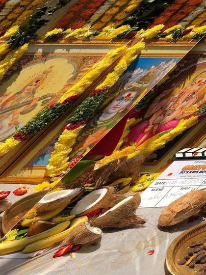 The official movie clapperboard from the 'Cartoons' inauguration pooja. This marks the official start of production and the beginning of my work in bringing the characters' styles to life on screen.