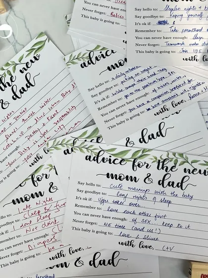 'Advice for the new mom & dad' cards are a wonderful keepsake. This interactive element allows guests to share their wisdom and well wishes in a personal way.