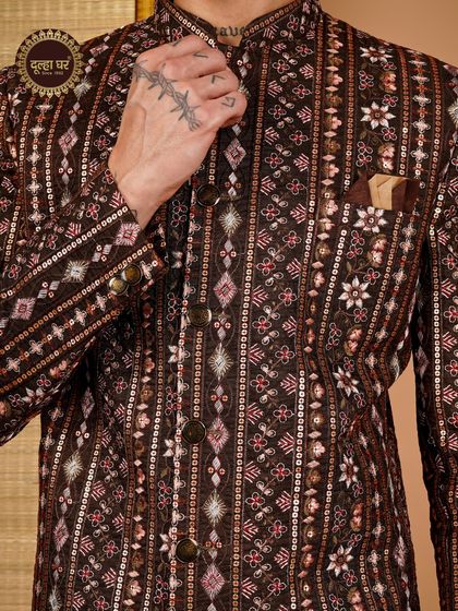 Royalty in every detail. Another angle on the brown sherwani, emphasizing the rich textures and craftsmanship.