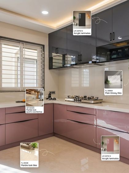 For a touch of modern glamour, this kitchen combines dusty pink and dark grey acrylic laminates. The look is completed with a marble-look quartz countertop and glossy backsplash tiles, creating a space that is both chic and functional.