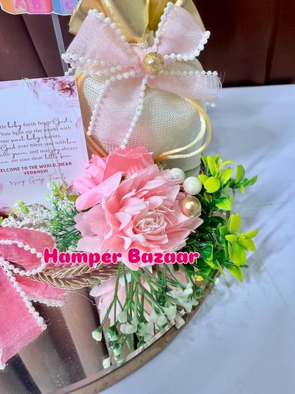 A different angle showing the delicate arrangement of flowers and the personalized card.