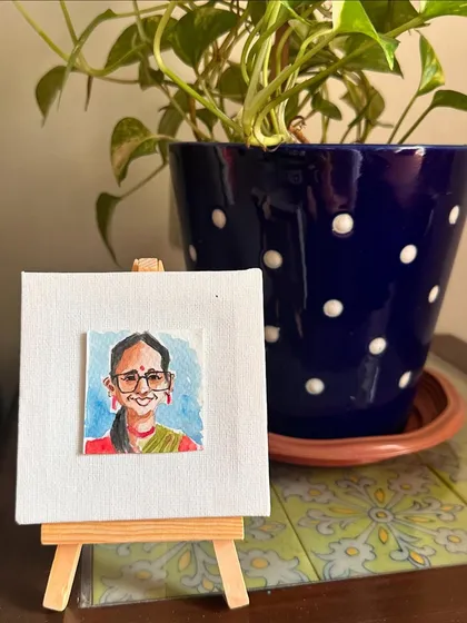 My mini portrait of Sabhyata on an easel.