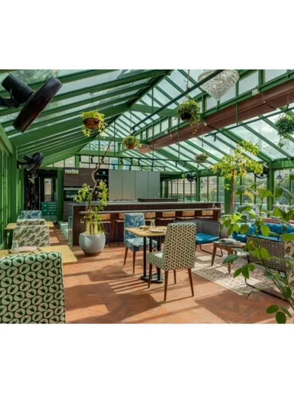 This rooftop culinary studio in Bangalore was designed as a modern Victorian conservatory. The iron and glass structure creates a light filled space for culinary events, furnished with an eclectic mix of our custom pieces.