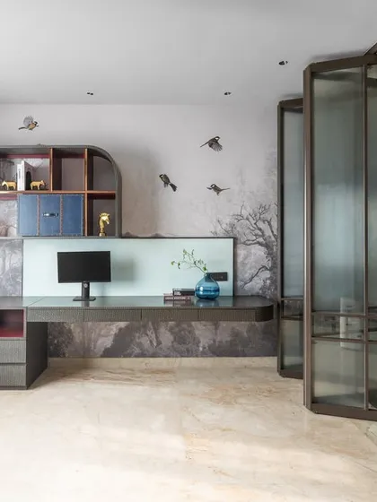Another angle of the study, highlighting the custom shelving and serene wallpaper. The design creates a space that is suitable for both focused work and creative play.