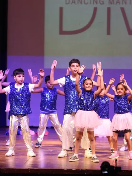 Our little stars shining bright on the big stage! This kids' group performance shows the confidence and joy we nurture in our youngest dancers. Seeing them own the stage in their sequined costumes is what makes it all worthwhile.