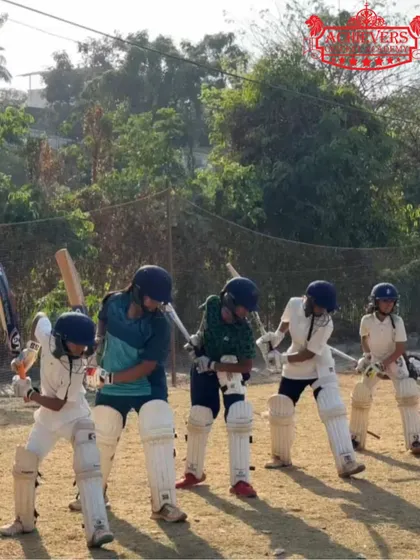 A group of young batsmen lined up for a drill, ready to put their skills to the test.
