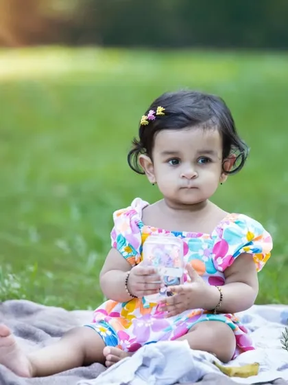 A quiet moment on a picnic blanket, soaking in the sunshine. I look for these peaceful, candid moments during a session to capture the gentle and thoughtful side of a child's personality.