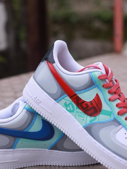 A close-up of the Monopoly-themed side, with the iconic property card design integrated into the swoosh.