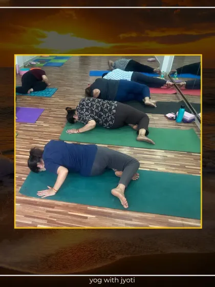 Students in a restorative pose, lying on their sides to gently open the shoulders and chest.