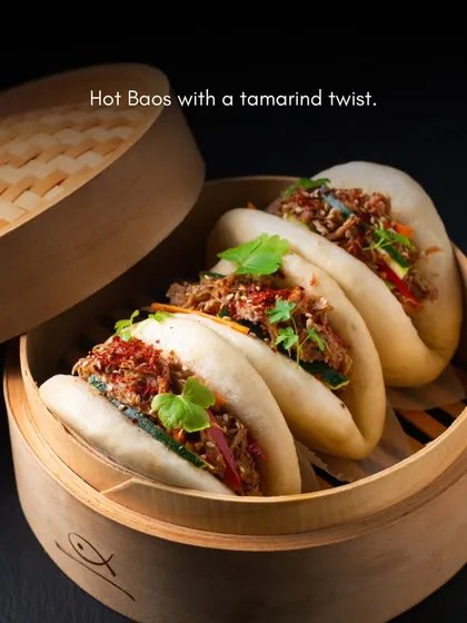 A taste of our Pan-Asian expertise. These hot, fluffy baos filled with a savory tamarind-twisted filling are served fresh from a traditional bamboo steamer, offering guests an authentic and comforting gourmet experience.