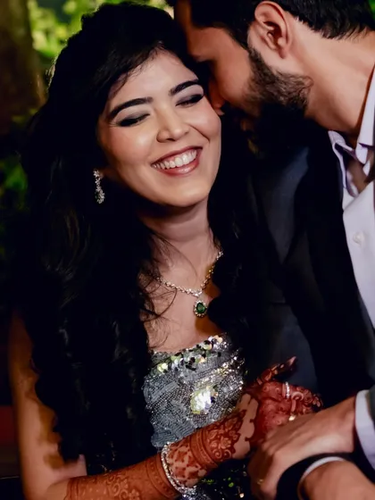 An intimate and happy moment between the couple. Reeya's glam makeup looks stunning even in this candid, joyful shot.