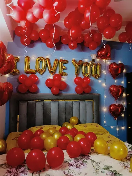 This is another angle of our "I LOVE YOU" room decoration, showing how fairy lights and heart-shaped foil balloons can be added to enhance the romantic mood for a special surprise.