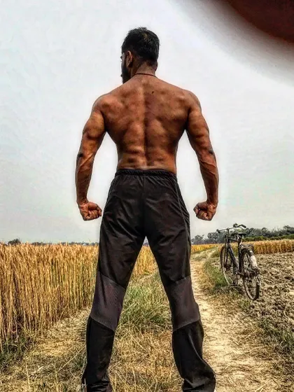 A strong back built not just in the gym, but with the discipline of a desi lifestyle. The fields are my backdrop, and hard work is my equipment.