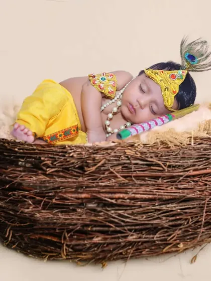Another adorable Little Krishna themed photo, with the baby sleeping peacefully in a nest prop.