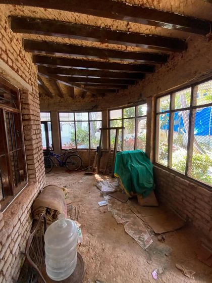 The enclosed verandah of the century-old villa during the restoration process. We aim to open up these spaces to light and the surrounding garden, breathing new life into every corner.