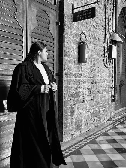 A contemplative black and white photo in the corridors of the Bombay High Court. I am a believer in justice, truth, and the power of a good argument.