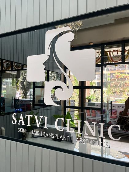 The Satvi Clinic logo on our entrance represents my commitment to combining medical science with aesthetic care to help you achieve healthy, beautiful skin.