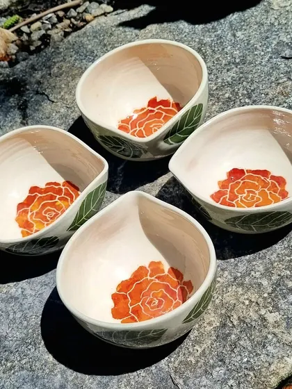 I designed these large, hand painted ceramic bowls to be used as diyas, perfect for festivals like Diwali or as unique decorative bowls. The interior features a hand painted rose, adding a beautiful detail when lit or used for serving. These are available in limited numbers and make for a thoughtful handmade gift.