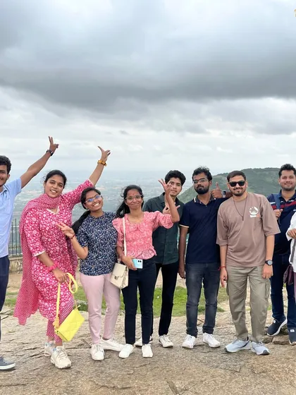 A group of travelers enjoying the view from Nandi Hills.