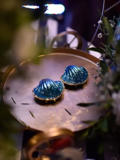 A beautiful detail of shell-shaped wedding favors, a perfect keepsake for the nautical-themed engagement party.